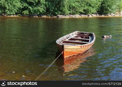 Old wooden boat on the river