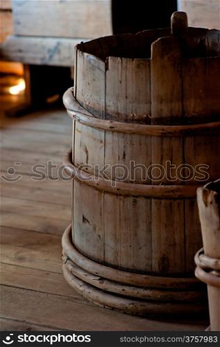 Old wooden bucket close-up in house