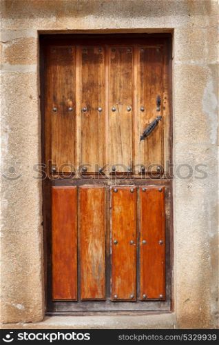 Old wooden door a with rusty lock