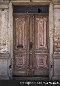 old wooden door. brown wooden door in an old building