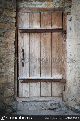 old wooden door in a stone wall