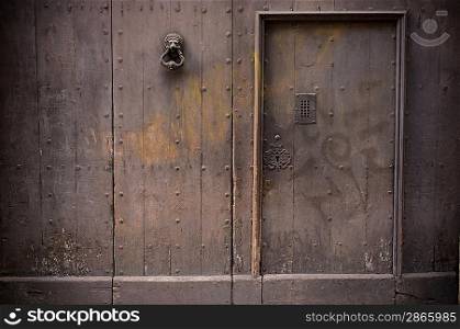 Old wooden door in fence