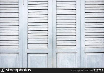 Old wooden door in traditional Thai style.