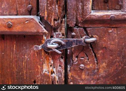 old wooden door locked on the latch