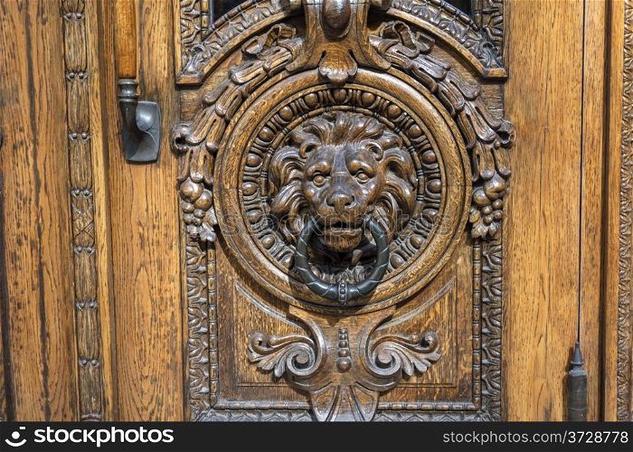 Old wooden door with handle closeup