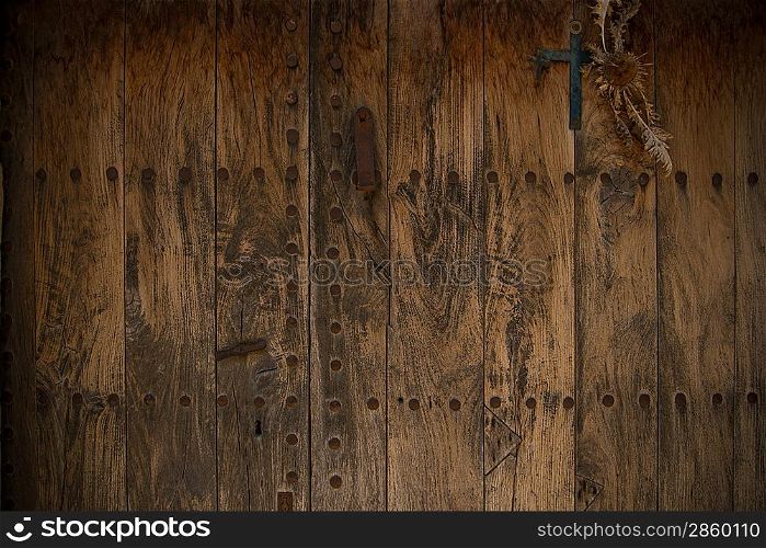 Old wooden door with metal knobs background