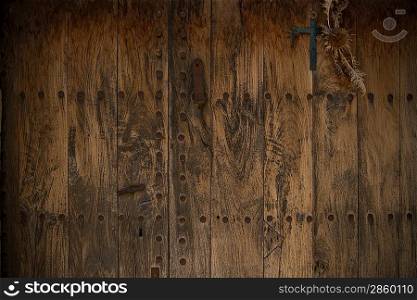 Old wooden door with metal knobs background