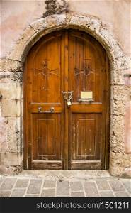 Old wooden doors, metal handles. Cose-up Castle. Old wooden doors, metal handles