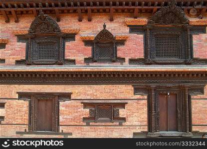 Old wooden doors of buddhistic house. Baktaphur, Nepal