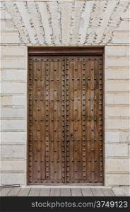 "Old wooden entrance door in Valladolid, "Castilla y Leon", Spain."