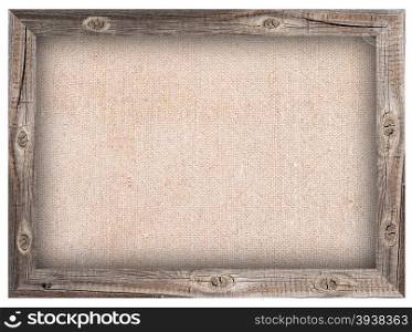 Old wooden frame with burlap background