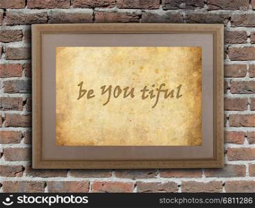 Old wooden frame with written text on an old wall - Be YOU tiful