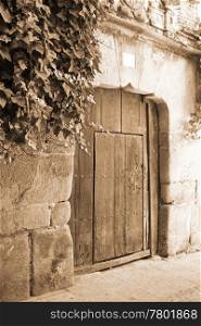 Old wooden gate in Segovia (Spain)