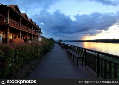 old wooden house along the river with beautiful sky background. old wooden house along the river