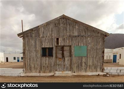 Old wooden house for fishermen with three windows