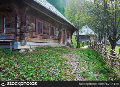 Old wooden house in autumn mountain village (Carpathian , Ukraine).