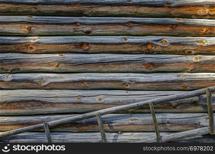 Old wooden house in village. Detail of a wall. Staircase.