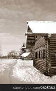 old wooden house in village , sepia