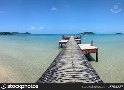 Old wooden jetty on exotic beach island, Thailand