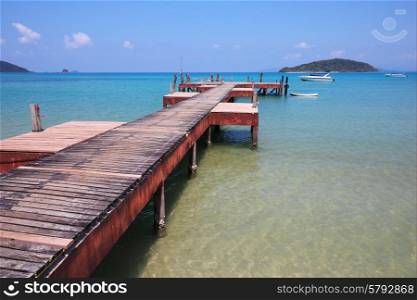 Old wooden jetty on exotic beach island, Thailand