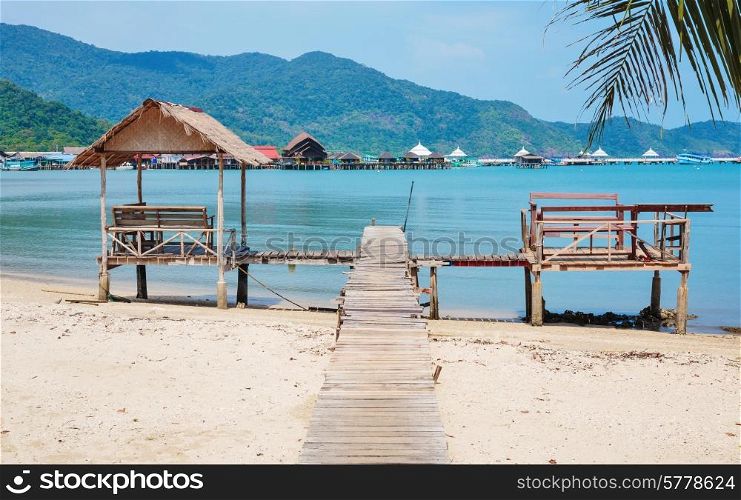 Old wooden jetty on exotic beach Koh Chang island, Thailand