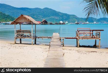 Old wooden jetty on exotic beach Koh Chang island, Thailand