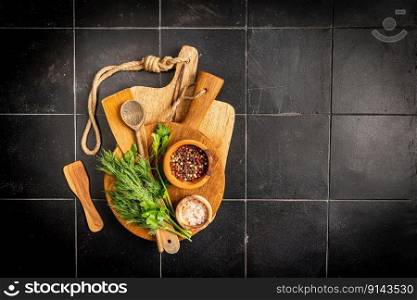 Old wooden kitchen utensils or cooking tools on black background, top view, flat lay. Kitchenware collection with copy space. Cooking background.. kitchen utensils or cooking tools