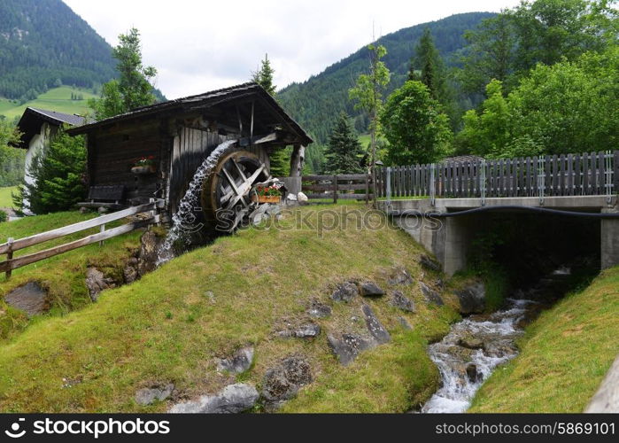 old wooden mill in mountains. mountain landscape