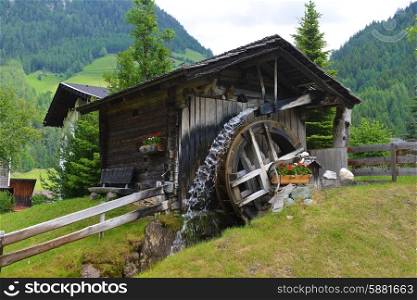 old wooden mill in mountains. mountain landscape