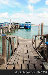 Old wooden pier for travel boat in Southern of Thailand.