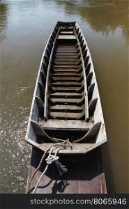 old wooden row boat on river