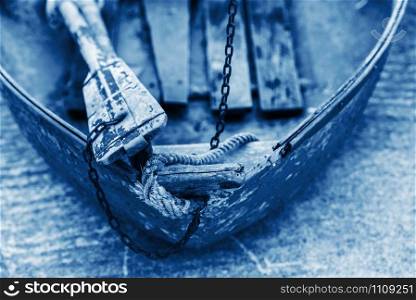 Old wooden shabby fishing boat detail. Color of the year 2020 classic blue toned