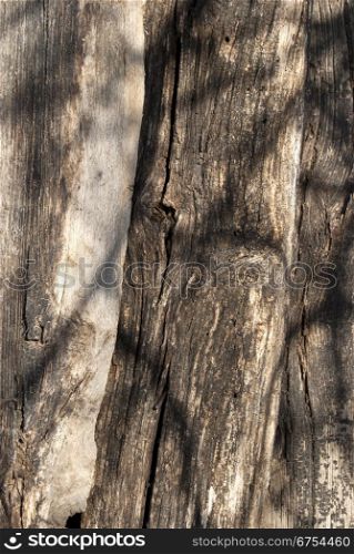 Old wooden stacked weathered beams as background
