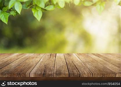 Old wooden table With the color of spring In the morning the warm sunshine