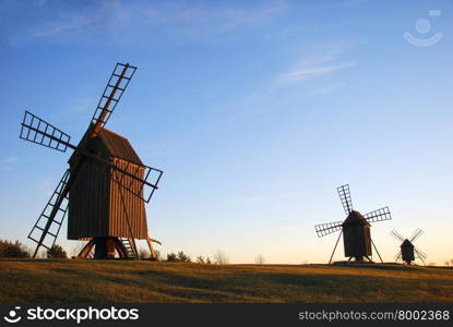 Old wooden windmills in a row at the swedish island Oland, the island of sun and wind
