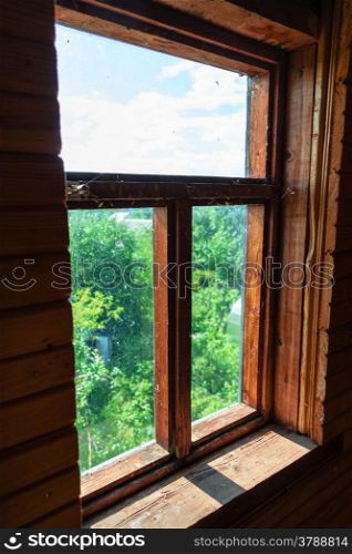 Old wooden window. View to garden