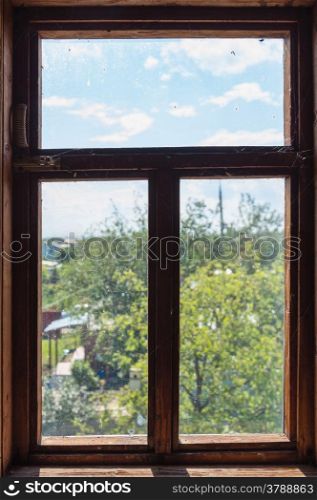 Old wooden window. View to garden