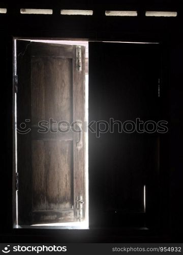 Old wooden window with light through.