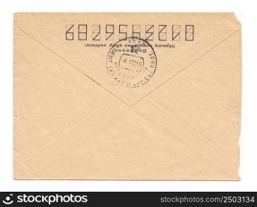 "Old worn envelope with USSR meter stamp, worn and yellowed paper, closed, isolated on white background. Russian inscription: "Attention! Sample of filling zip-code""