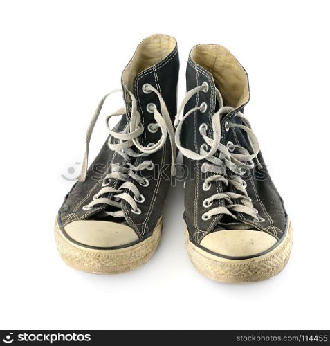 Old worn sneakers isolated on white background. Top view.