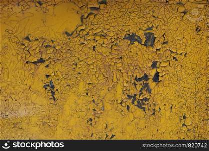 Old yellow cracked paint background. Grunge texture template for overlay artwork.