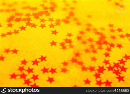Old yellow holiday wallpaper with a stars