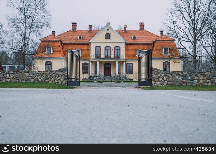 Old yellow manor at Latvia, city Liepupe. 2016