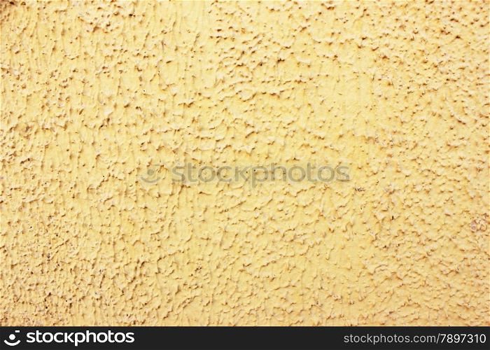 Old yellow wall stucco texture.