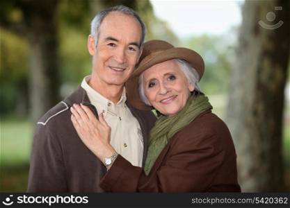 Older couple enjoying an autumnal stroll