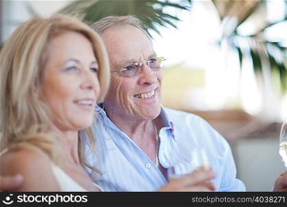 Older couple having wine together