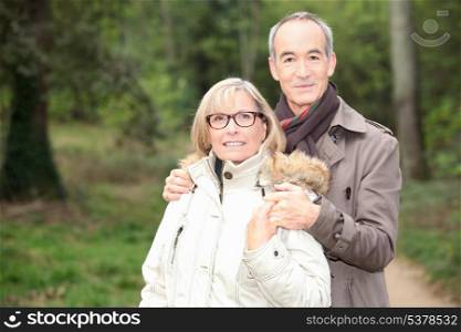 Older couple in a forest