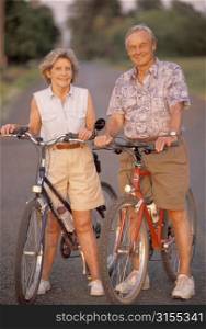 Older Couple Riding Bikes Together