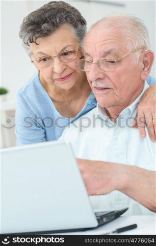 older couple surfing the web