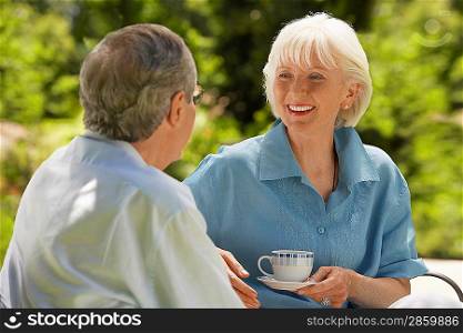 Older Couple Talking Outdoors